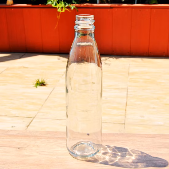 Botella de vidrio de grado alimenticio transparente para jugo de agua y bebidas al por mayor de botella de embalaje de 1 L